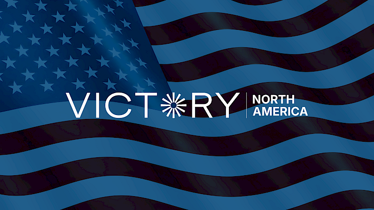 Victory North America logo, USA state flag in the background with Victory Lighting blue overlay
